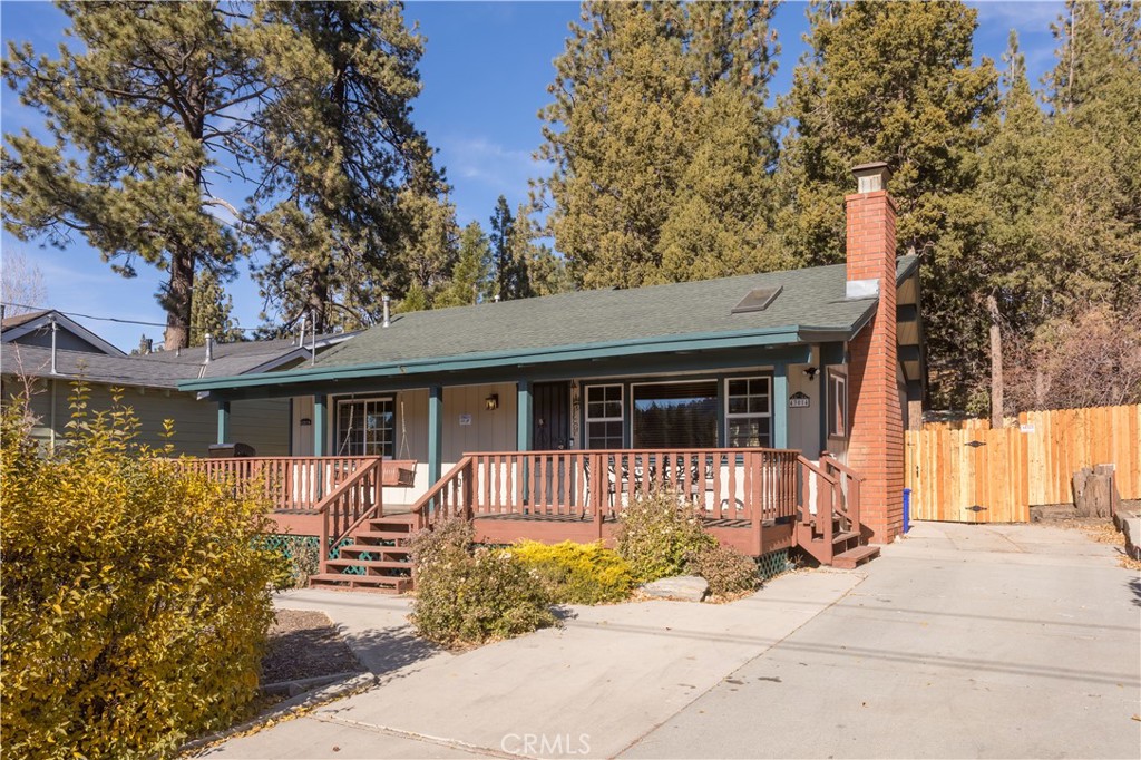 43014 Moonridge Road Big Bear Lake, CA 92315 - Photo 22 of 22 a front view of a house with garden