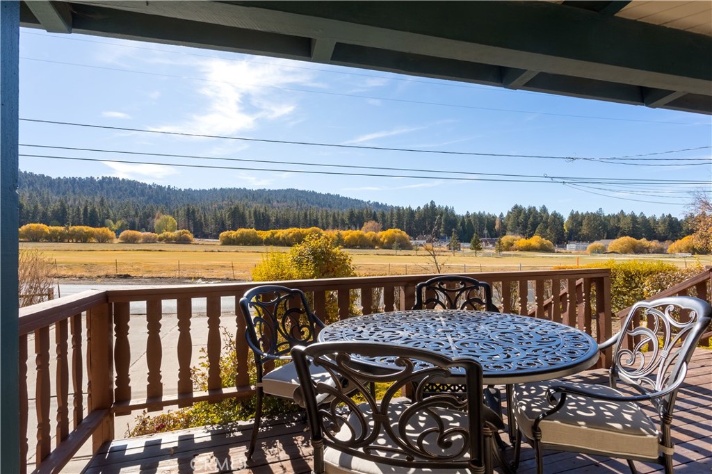 43014 Moonridge Road Big Bear Lake, CA 92315 - Photo 4 of 22 a view of a balcony with two chairs and a table