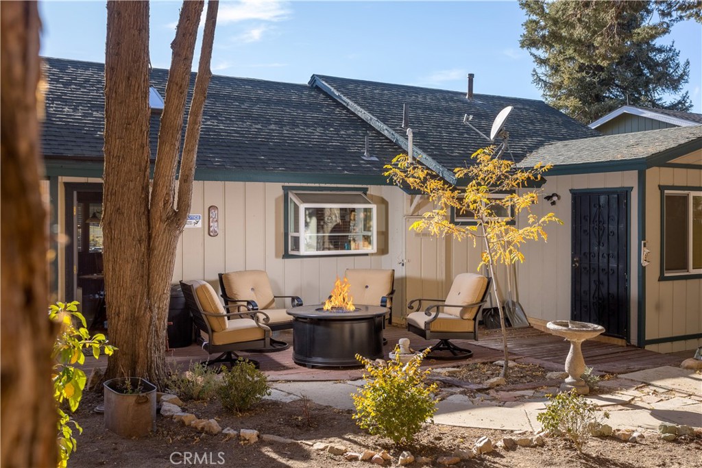 43014 Moonridge Road Big Bear Lake, CA 92315 - Photo 8 of 22 a front view of a house with outdoor seating
