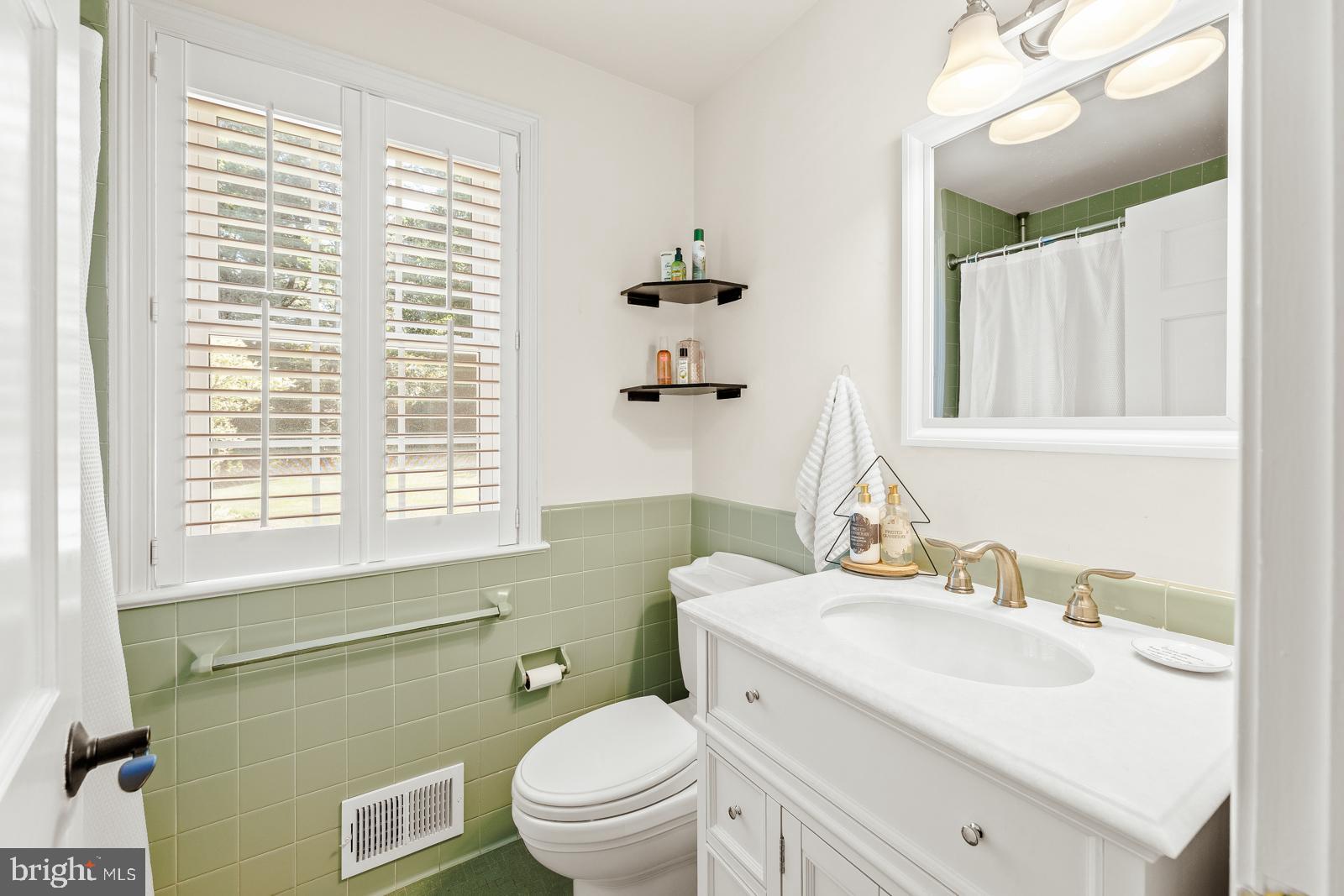 1700 Old Welsh Road Huntingdon Valley, PA 19006 - Photo 29 of 105 a bathroom with a sink a toilet and a mirror