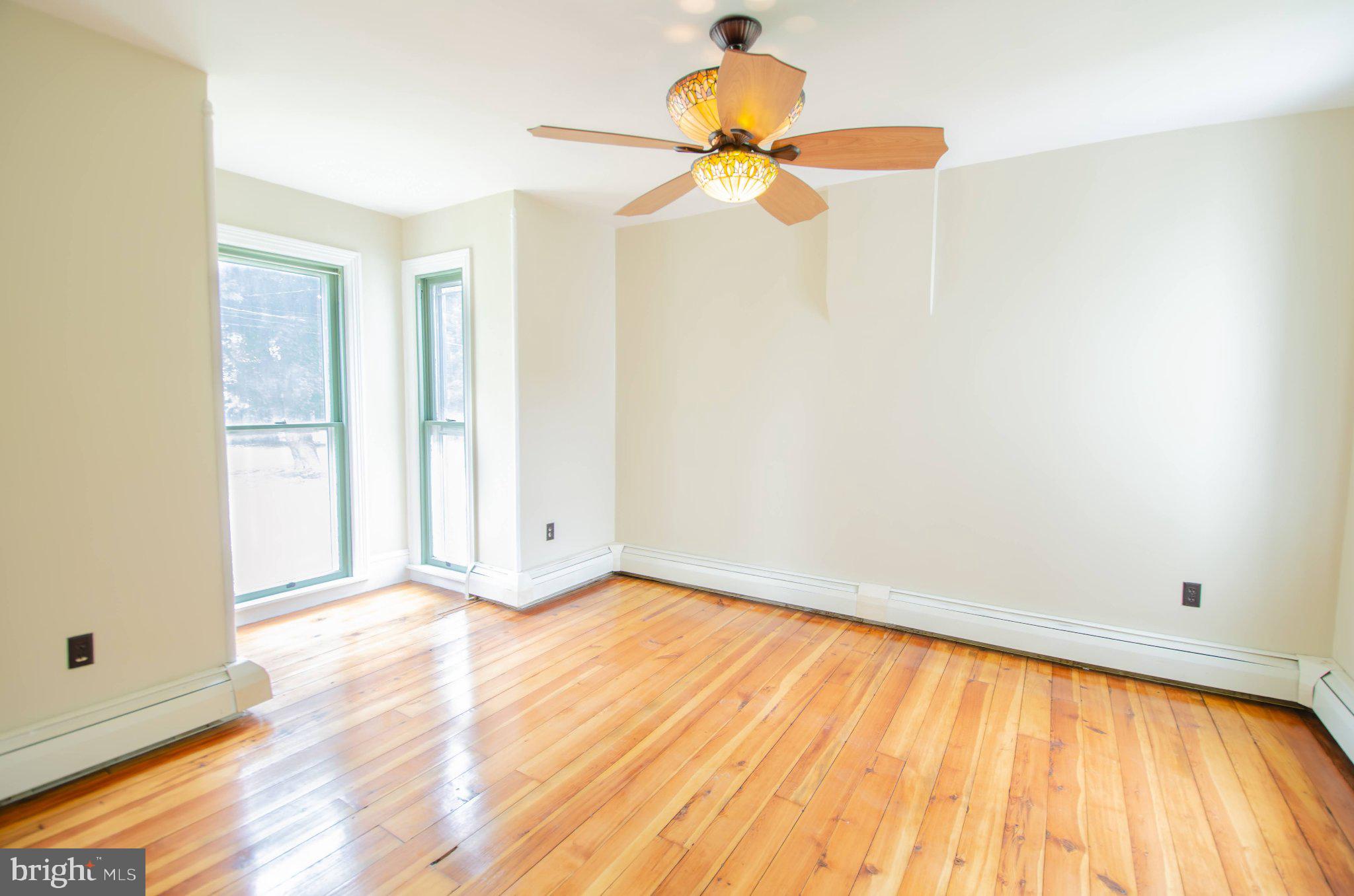 2615 Walnut Bottom Road Carlisle, PA 17015 - Photo 15 of 38 Bright and airy room with hardwood floors.