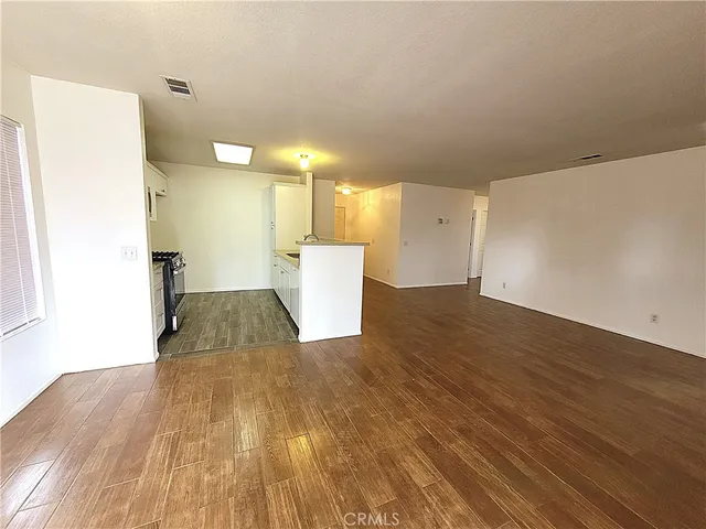 a view of a kitchen with wooden floor
