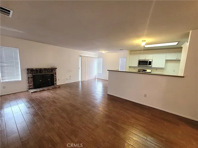 a view of a kitchen with a sink and a stove top oven