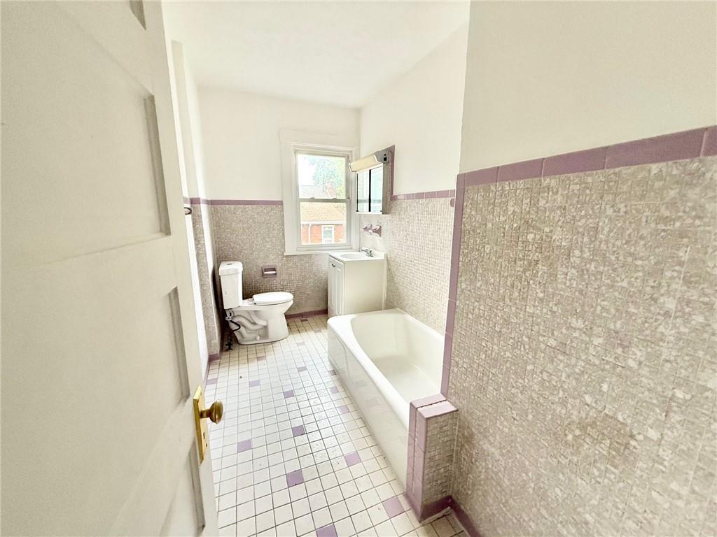 864 Vankirk Street Clairton, PA 15025 - Photo 7 of 10 a bathroom with a sink and a mirror