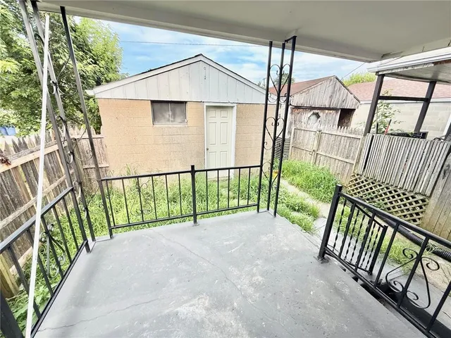 a view of a house with wooden floor in outdoor space