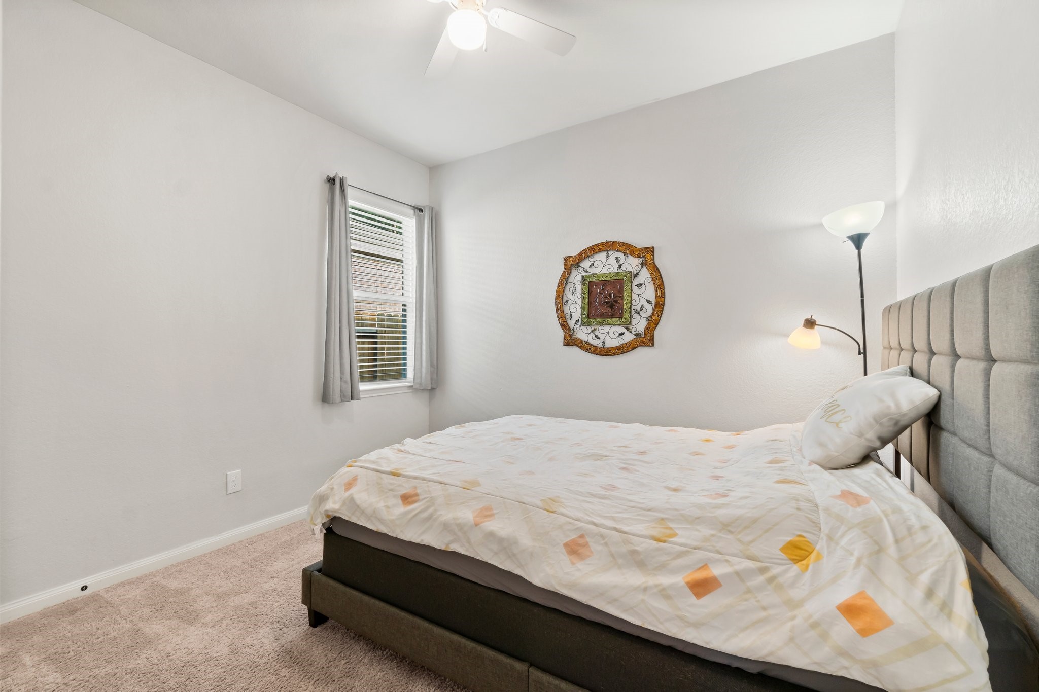 7643 Glaber Leaf Road Conroe, TX 77304 - Photo 19 of 26 Third bedroom. Both secondary bedrooms have nice sized closets. This bedroom has a blue accent wall now.