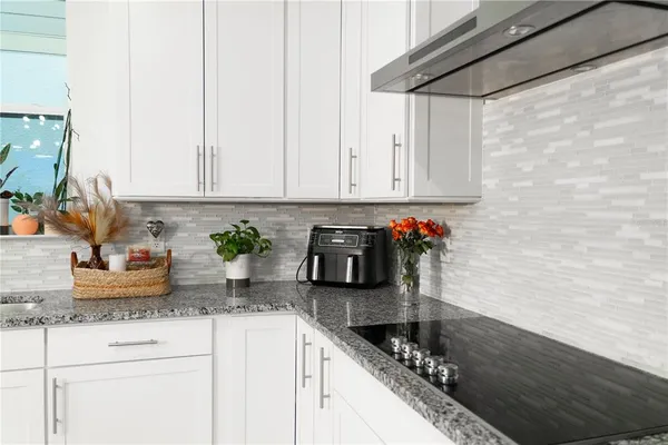 a kitchen with a table and a stove