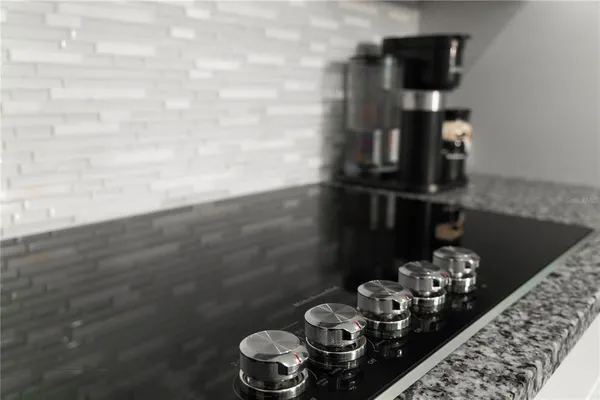 a bedroom with a bed and a potted plant