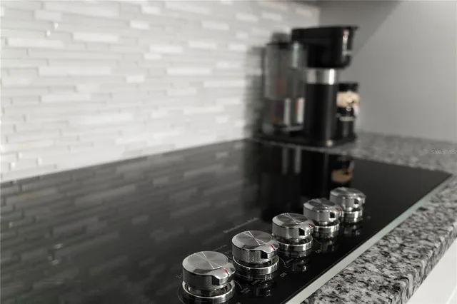 a bedroom with a bed and a potted plant