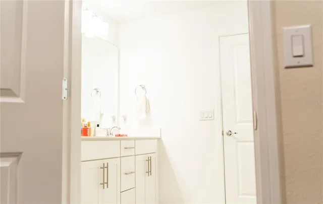 a bedroom with a bed and a television