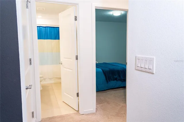 a view of a room with wooden floor and cabinet