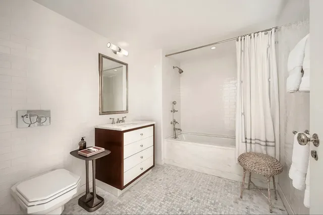 a bathroom with a sink a toilet and a bathtub