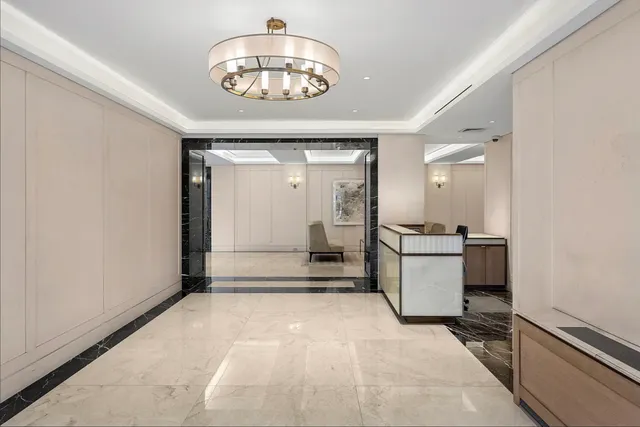a view of a hallway with a chandelier