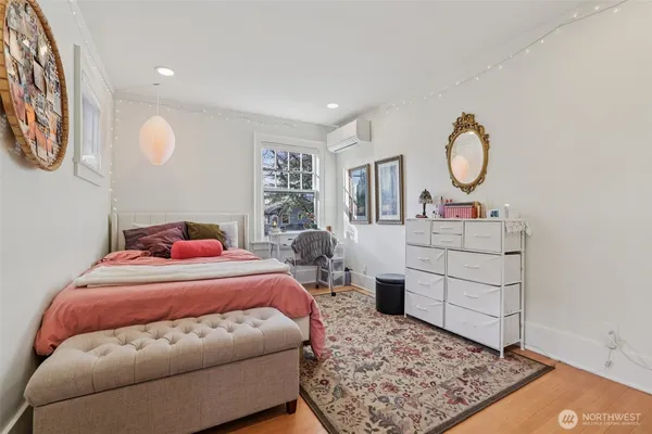 a bedroom with a bed and window