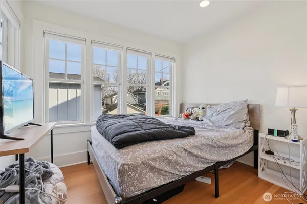 a bedroom with a bed and window