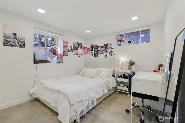 a bedroom with a bed and furniture