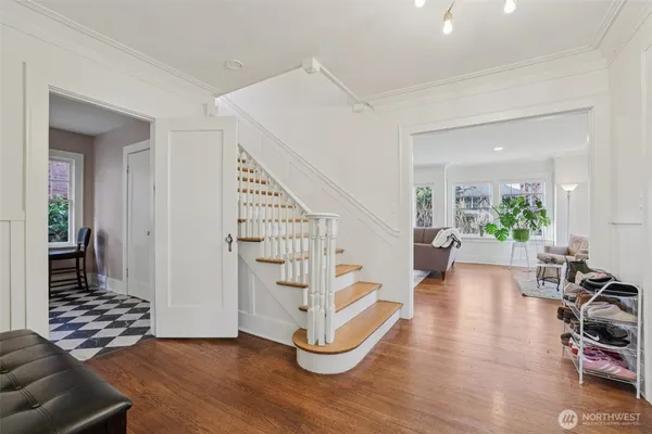 a view of a livingroom with furniture and stairs
