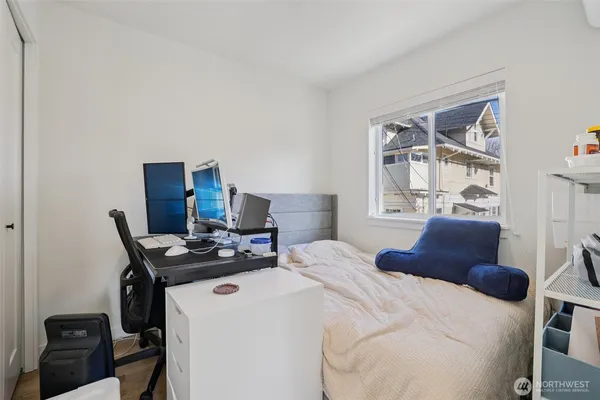a bedroom with a bed and a table