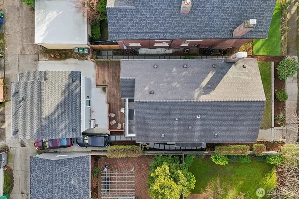 an aerial view of residential houses with outdoor space