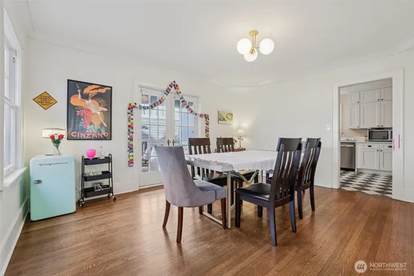 a view of a dining room with furniture and wooden floor