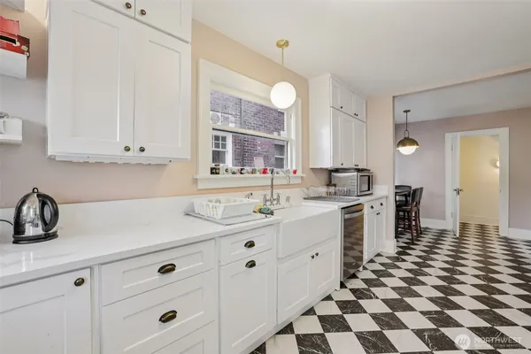 a kitchen with a sink and cabinets