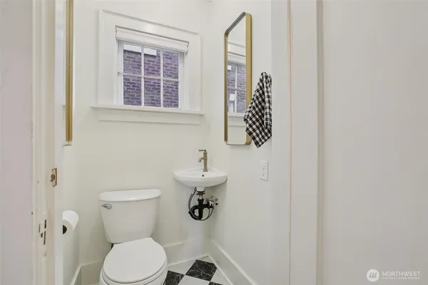 a bathroom with a toilet and a sink