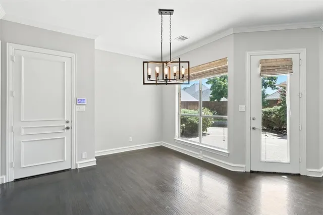 a view of a kitchen with a fireplace and wooden floor