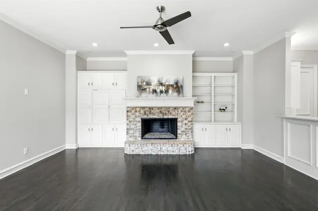 a bathroom with a granite countertop sink toilet a mirror and shower