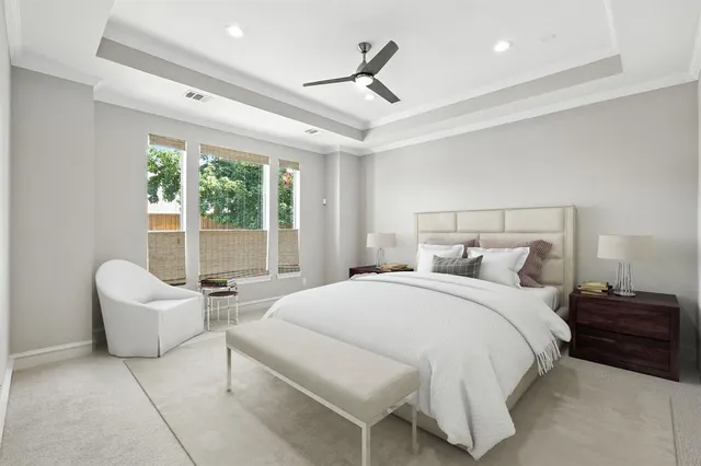 an empty room with a ceiling fan and window