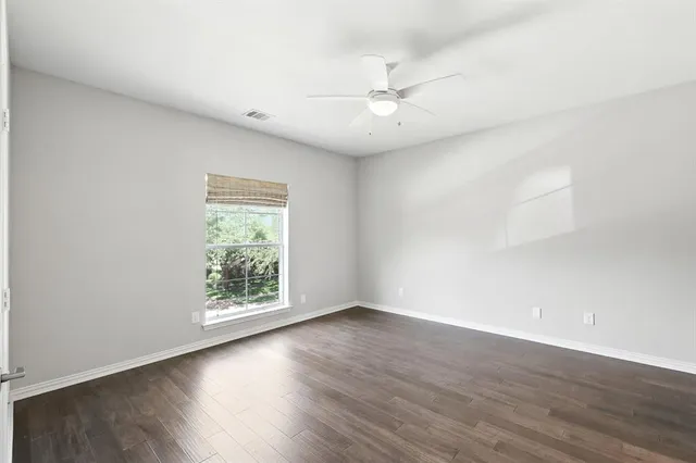a view of a lake with a house in the background