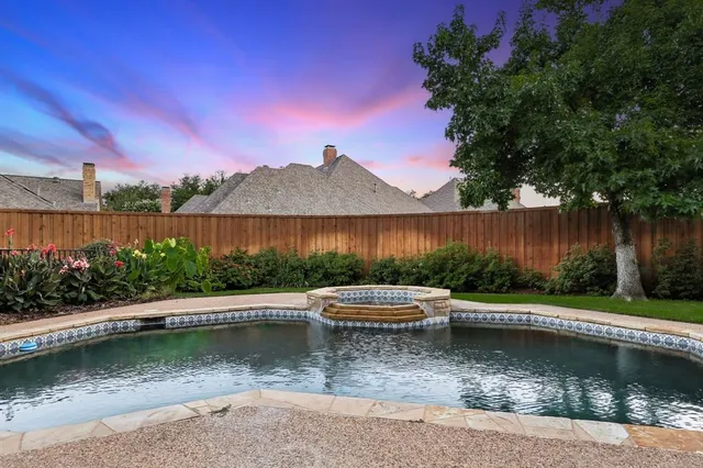 an aerial view of a house with swimming pool