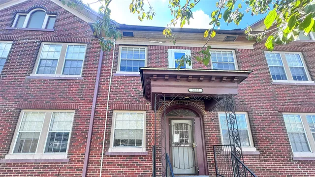 a front view of a house with a garage