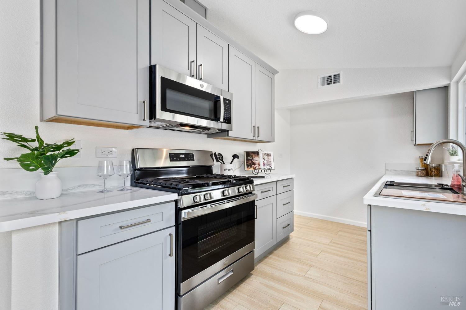 240 Rinaldo Drive Vallejo, CA 94589 - Photo 16 of 41 a kitchen with cabinets stainless steel appliances and a sink