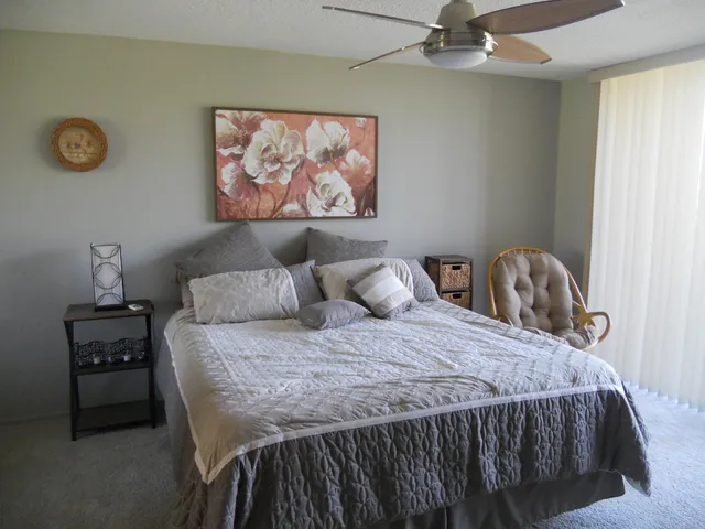 a bedroom with a bed and a dresser in it