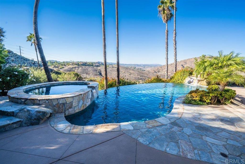 a view of a swimming pool with a sitting space