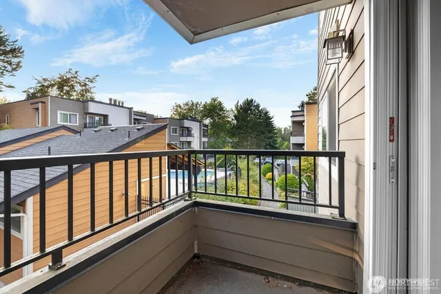 a view of balcony with furniture