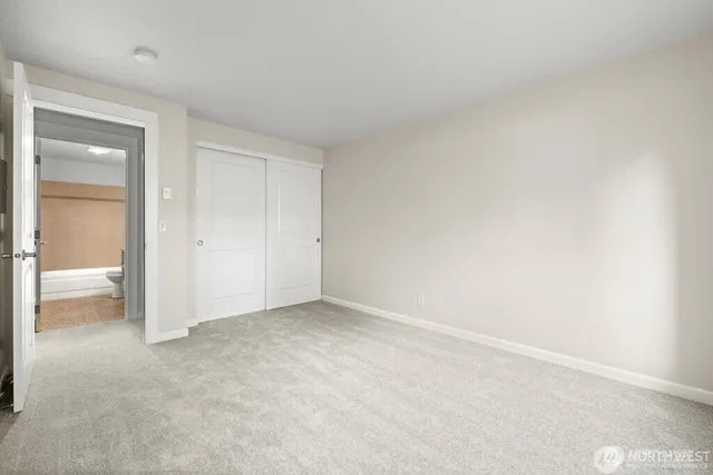 a view of an empty room and closet