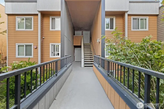 a view of a balcony with wooden floor