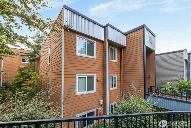 a view of a house with a small yard