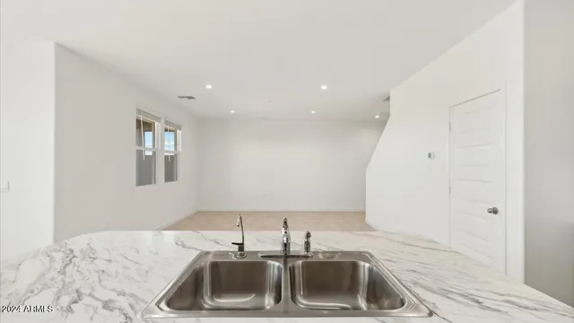 a kitchen with a sink and cabinets