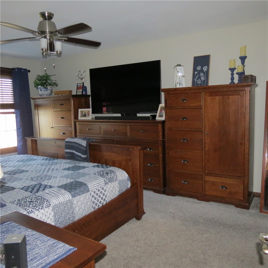 10160 Lochard Road Sidney, OH 45365 - Photo 20 of 41 This spacious bedroom features ample natural light and a comforting atmosphere.