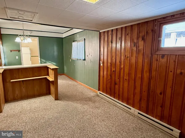 a room with window and furniture