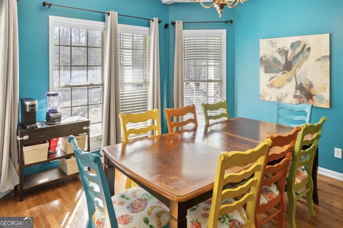 4430 Oak Hill Church Road Millen, GA 30442 - Photo 11 of 41 a view of a dining room with furniture and a floor to ceiling window