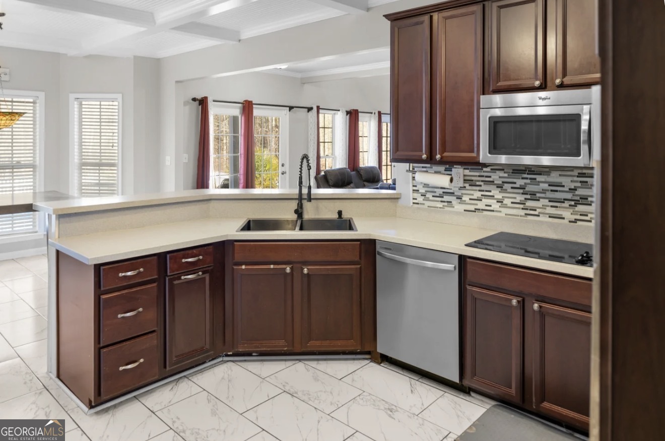 4430 Oak Hill Church Road Millen, GA 30442 - Photo 13 of 41 a kitchen with a sink stove and cabinets