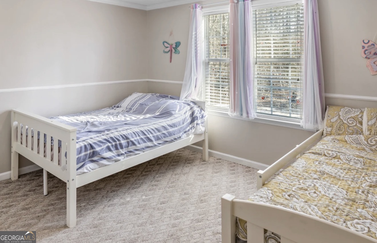 4430 Oak Hill Church Road Millen, GA 30442 - Photo 23 of 41 a bedroom with a bed and window