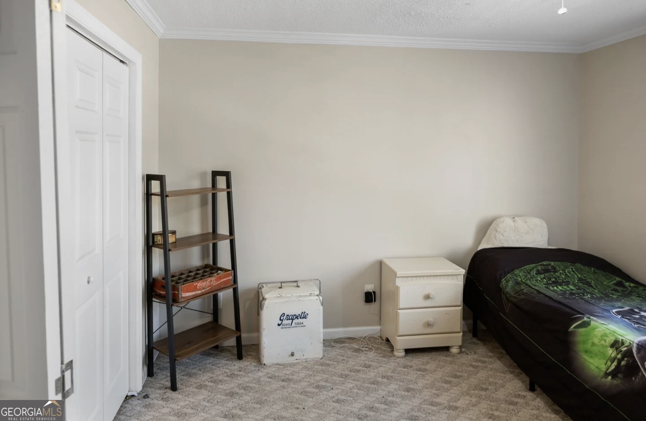 4430 Oak Hill Church Road Millen, GA 30442 - Photo 28 of 41 a bedroom with a bed and a window