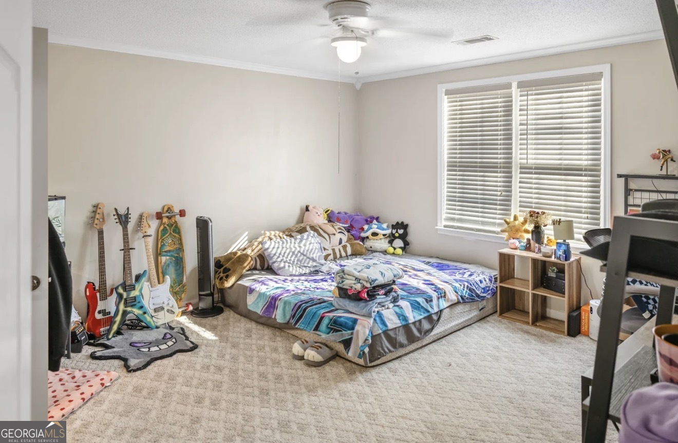 4430 Oak Hill Church Road Millen, GA 30442 - Photo 30 of 41 a bedroom with bed and a window