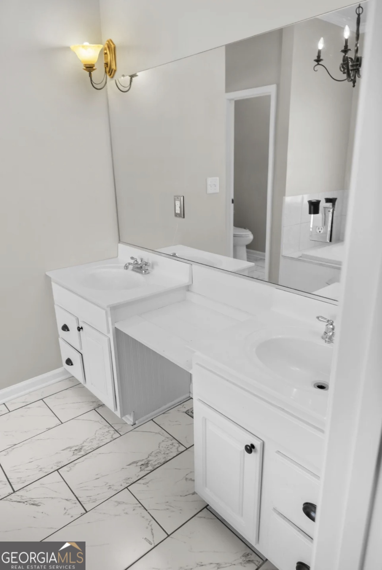 4430 Oak Hill Church Road Millen, GA 30442 - Photo 36 of 41 a bathroom with a sink and a mirror