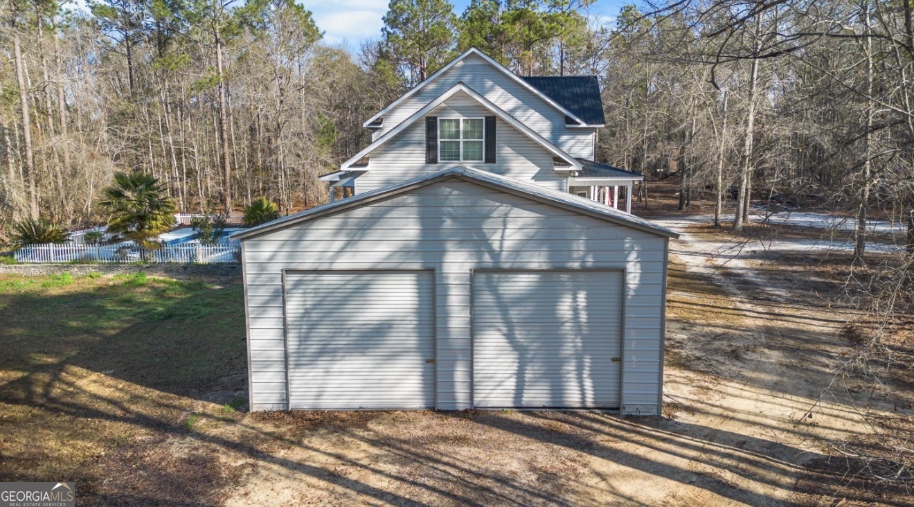 4430 Oak Hill Church Road Millen, GA 30442 - Photo 5 of 41 a front view of a house with a yard