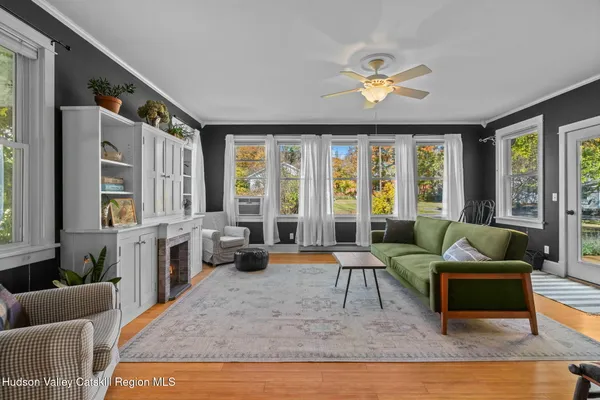 a living room with furniture and a fireplace